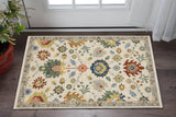 2' X 3' Ivory Red And Blue Oriental Area Rug With Fringe