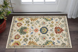 3' X 5' Ivory Blue And Red Oriental Area Rug With Fringe