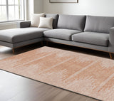 8' X 10' Salmon And Ivory Abstract Washable Indoor Outdoor Area Rug