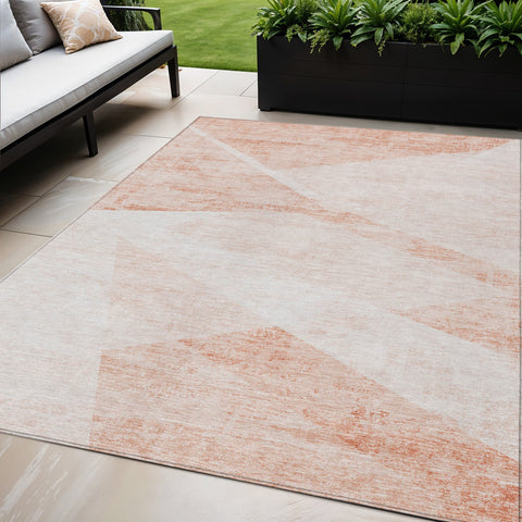 5' X 8' Salmon Peach And Ivory Abstract Washable Indoor Outdoor Area Rug
