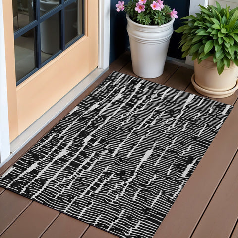 3' X 5' Black And Ivory Abstract Washable Indoor Outdoor Area Rug