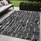 5' X 8' Black And Ivory Abstract Washable Indoor Outdoor Area Rug