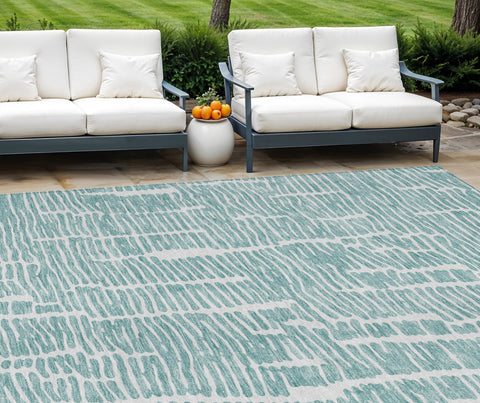8' X 10' Teal Blue And Ivory Abstract Washable Indoor Outdoor Area Rug