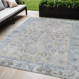 5' X 8' Beige Blue And Ivory Oriental Washable Indoor Outdoor Area Rug