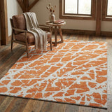 5' X 8' Orange And Ivory Abstract Washable Area Rug With UV Protection