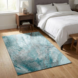 3' X 5' Teal And Ivory Abstract Washable Area Rug With UV Protection