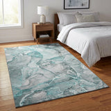 3' X 5' Teal And Ivory Abstract Washable Area Rug With UV Protection