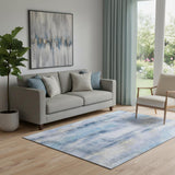 5' X 8' Blue And Ivory Abstract Washable Area Rug With UV Protection