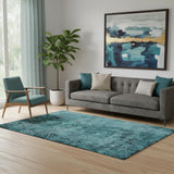 5' X 8' Teal And Ivory Abstract Washable Area Rug With UV Protection