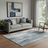 5' X 8' Teal And Ivory Abstract Washable Area Rug With UV Protection