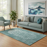 5' X 8' Teal And Ivory Abstract Washable Area Rug With UV Protection