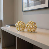 Set of Two Gold Ivory And Pearl Faux Crystal And Metal Decorative Orbs