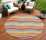8' Coral Gold And Peach Round Striped Washable Indoor Outdoor Area Rug