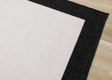7' X 10' Black And Cream Area Rug