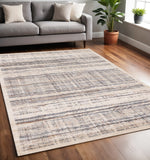 5' X 8' Beige Gray And Brown Abstract Area Rug