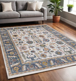 5' X 8' Cream Blue And Green Medallion Area Rug