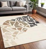 5' X 8' Cream Black And Tan Abstract Area Rug