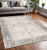 5' X 8' Cream Blue And Gray Medallion Area Rug