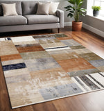 5' X 8' Beige Orange And Brown Geometric Area Rug