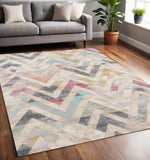 5' X 8' Cream Blue And Pink Chevron Area Rug