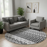 8' Black And Ivory Ikat Washable Round Rug With UV Protection
