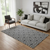 5' X 8' Black And Ivory Geometric Washable Area Rug With UV Protection