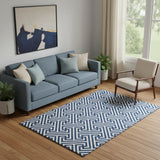 5' X 8' Blue And Ivory Geometric Washable Area Rug With UV Protection