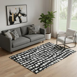 5' X 8' Black And Ivory Cobblestone Washable Area Rug With UV Protection
