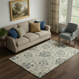 5' X 8' Beige Blue And Tan Floral Washable Area Rug With UV Protection