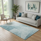 5' X 8' Teal And Ivory Geometric Washable Area Rug With UV Protection