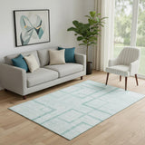 5' X 8' Teal And Ivory Geometric Washable Area Rug With UV Protection