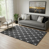5' X 8' Black And Ivory Abstract Geometric Washable Area Rug With UV Protection