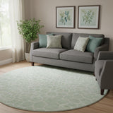 8' Mint Green And Ivory Geometric Washable Round Rug With UV Protection