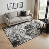 5' X 8' Black And Ivory Abstract Washable Area Rug With UV Protection