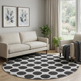 8' Black And Ivory Polka Dot Washable Round Rug With UV Protection