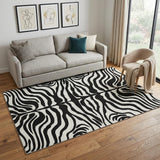 5' X 8' Black And Ivory Animal Print Washable Area Rug With UV Protection