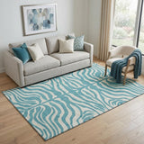 5' X 8' Teal And Ivory Animal Print Washable Area Rug With UV Protection