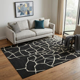 5' X 8' Black And Ivory Abstract Geometric Washable Area Rug With UV Protection