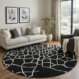 8' Black And Ivory Abstract Geometric Washable Round Rug With UV Protection