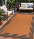 5' X 8' Orange And Dark Gray Striped Indoor Outdoor Area Rug