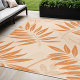 5' X 8' Cream And Orange Floral Indoor Outdoor Area Rug