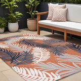 8' X 10' Orange Navy Blue And Ivory Floral Indoor Outdoor Area Rug