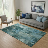 5' X 8' Teal And Aqua Abstract Washable Area Rug With UV Protection