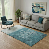 5' X 8' Teal And Ivory Abstract Washable Area Rug With UV Protection