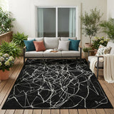 5' X 8' Black And Ivory Abstract Washable Indoor Outdoor Area Rug