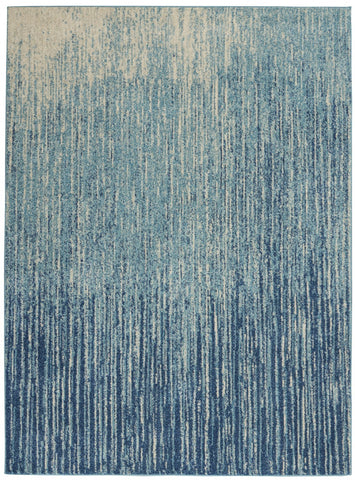 5' X 7' Ivory And Blue Abstract Power Loom Area Rug