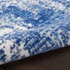 6' X 9' Blue And Ivory Abstract Dhurrie Area Rug